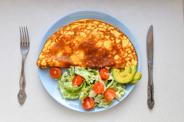 Morning breakfast, scrambled eggs with vegetable salad, top view, place for writing
