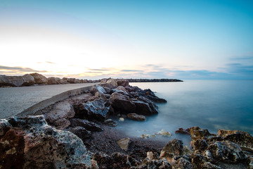 sunset on coast of sea