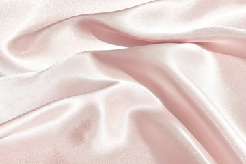 Charming smooth satin and silk pink fabric for backgrounds. Elegant abstract upholstery use for...
