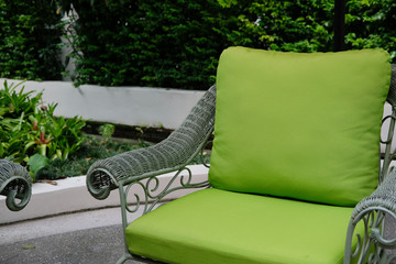 green rattan chair in terrace balcony. living design for home interior