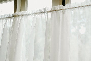 white see through window curtain at home