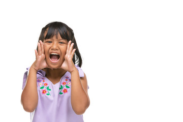 Cute asian dark little girl making a funny emotion on face .