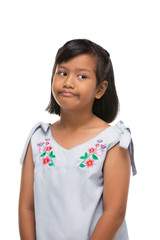 Cute asian dark little girl making a funny emotion on face .