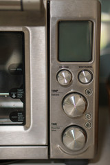Stainless steel toaster oven controls