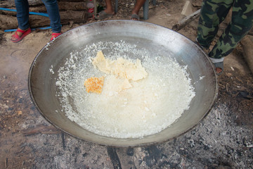Rice cooking with a large pan for merit work in the Northeast region of Thailand
