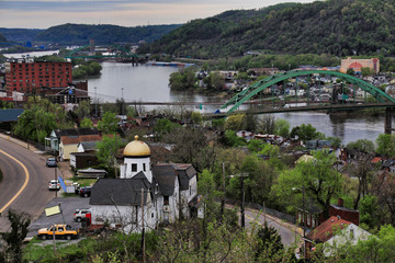 This is an aerial view of Wheeling, West Virginia along the Ohio River.  This skyline cityscape shows Wheeling Island in the distance.