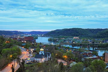 This is an aerial view of Wheeling, West Virginia along the Ohio River.  This skyline cityscape shows Wheeling Island in the distance.