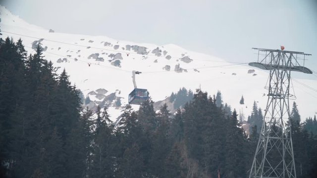 Ski tram takes skiers to the higher mountains in the swiss alps