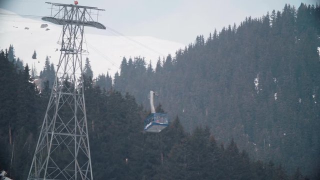 Ski tram takes skiers to the higher mountains in the swiss alps