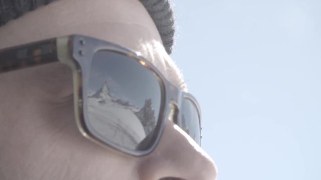 The Matterhornd seen in reflection of persons glasses