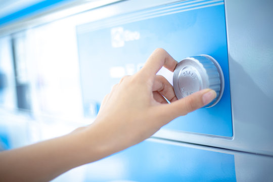 Close Up Hand Is Turning Dial Knob Of Laundry Washing Machine