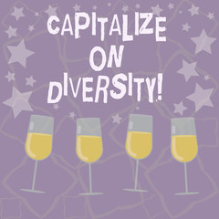 Writing note showing Capitalize On Diversity. Business photo showcasing Bringing together workers with different ethnicity Filled Cocktail Wine Glasses with Scattered Stars as Confetti Stemware