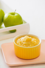 Homemade healthy baby food. Bowl of apple baby puree.