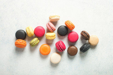 Different macaroons on a light background. Top view