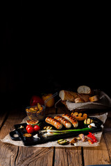 Delicious  grilled sausage with various grilled vegetables