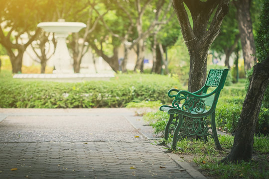 Chairs in the park in warm light conditions in the evening
