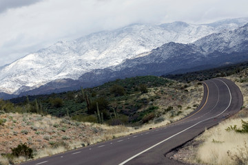 road into the snowy mountains