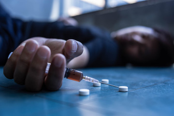 Asian men are drug addicts to inject heroin into their veins themselves.Flakka drug or zombie drug...