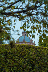 Obraz premium church dome between trees