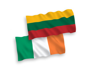 National vector fabric wave flags of Lithuania and Ireland isolated on white background. 1 to 2 proportion.