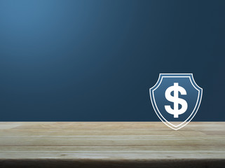 Dollar with shield flat icon on wooden table over light blue gradient background, Business money insurance and protection concept