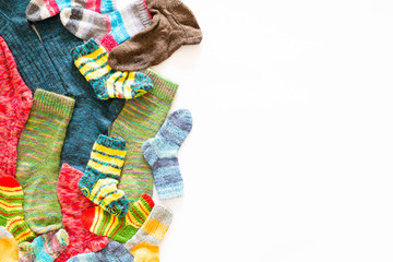 Colorful woolen socks on white background