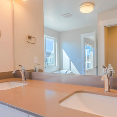 Fototapeta na wymiar Frame Square Double sink vanity inside the modern bathroom of a new house