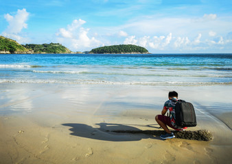 a man walking on the beach.