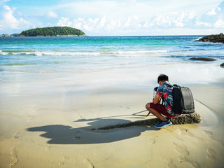 a man walking on the beach.