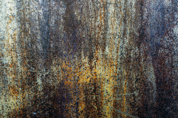 An old metal wall, rusty from time to time, of iron