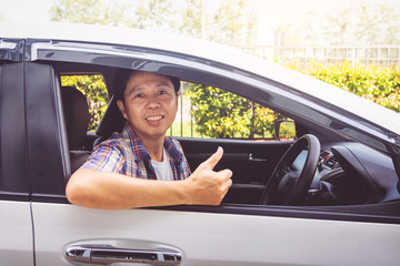 Asia man smile happy and drive car