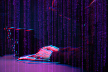 Hacker working with laptop in dark room with digital interface around. Image with glitch effect.
