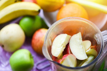 Fruit Smoothie / Fresh fruit slice in the blender preparing healthy juice summer ingredients