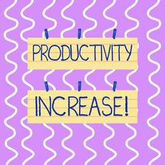 Conceptual hand writing showing Productivity Increase. Concept meaning Labor productivity growth More output from worker Strip Size Lined Paper Sheet Hanging Using Blue Clothespin