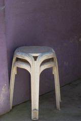Stacked stools by the wall