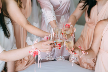 Close up, girls hands with glasses of champagne celebrates beginning of wedding