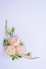Obraz na płótnie Canvas Floral arrangement, web banner with pink English roses, ranunculus, carnation flowers and green leaves on white table background. Flat lay, top view. Wedding or birthday styled stock photography.