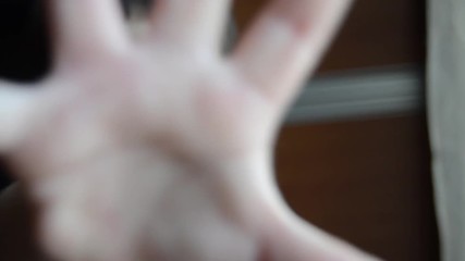 boy putting his hand in front of camera