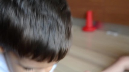 siblings playing on the floor, two years and 7 months old boys