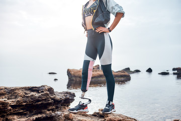 Love my unique body. Cropped image of sporty disabled woman in sportswear with bionic leg standing...