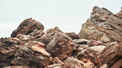 Big boulders on the beach. Nature landscape. Sky and rocks