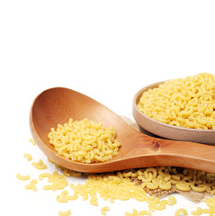 Italian pasta (Gomiti Rigati) on white background 