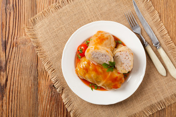 Traditional stuffed cabbage with minced meat and rice, served in a tomato sauce.