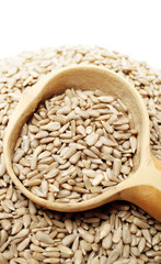 Peeled sunflower seeds pile on white background 