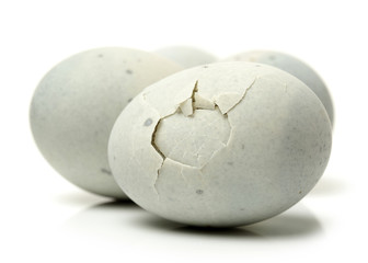 preserved duck eggs on white background