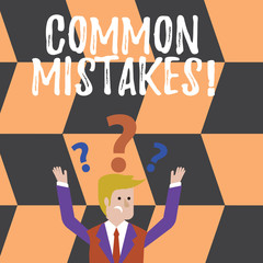 Word writing text Common Mistakes. Business photo showcasing repeat act or judgement misguided making something wrong Confused Businessman Raising Both Arms with Question Marks Above his Head