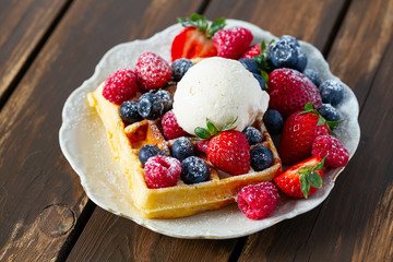 belgian waffles with ice cream and berries
