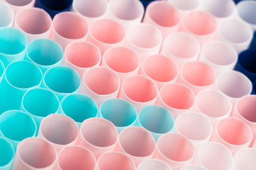 Abstract colorful background. Background from cocktail tubes close up. Soft focus. Cocktail tubes of different colors close up.Close-up of straw tubes.