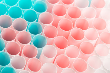Abstract colorful background. Background from cocktail tubes close up. Soft focus. Cocktail tubes of different colors close up.Close-up of straw tubes.