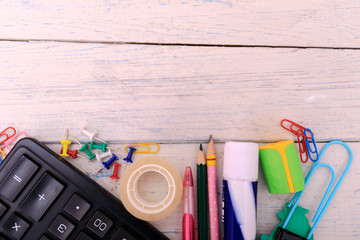 Back to school sale concept with copy space for text. School supplies on white wooden table. Bloggers backgorund. Time to study. School education background.